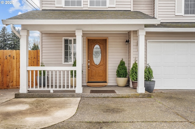 11619 NE 102nd Cir, Vancouver, WA 98662 - entrance to property featuring a porch, fence, roof with shingles, and a garage