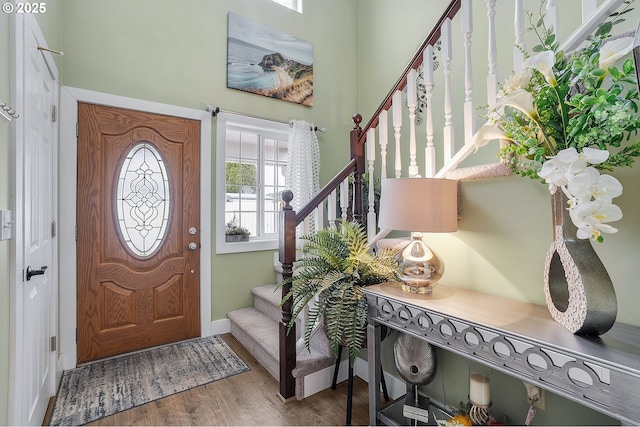 11619 NE 102nd Cir, Vancouver, WA 98662 - entryway with baseboards, wood finished floors, stairway, and a towering ceiling
