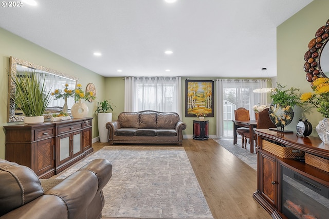 11619 NE 102nd Cir, Vancouver, WA 98662 - living room featuring recessed lighting, baseboards, a healthy amount of sunlight, and wood finished floors