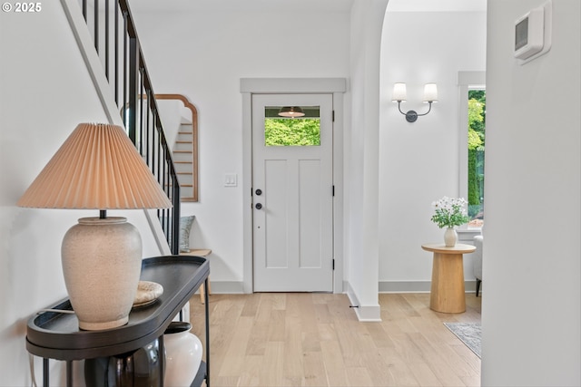625 NE 69th Ave, Portland, OR 97213 - entryway featuring light wood finished floors, stairs, healthy amount of natural light, and baseboards