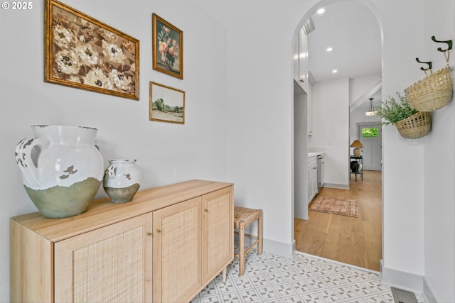 625 NE 69th Ave, Portland, OR 97213 - hall with baseboards, arched walkways, recessed lighting, and light flooring
