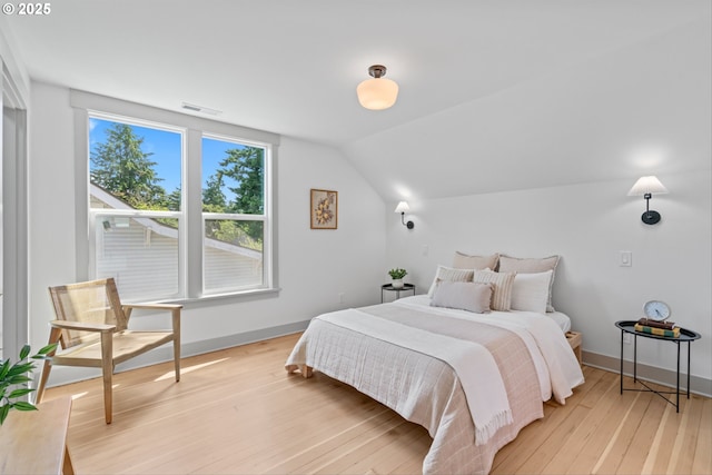 625 NE 69th Ave, Portland, OR 97213 - bedroom with vaulted ceiling, light wood finished floors, and baseboards