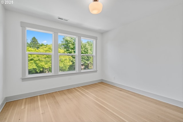 625 NE 69th Ave, Portland, OR 97213 - unfurnished room with plenty of natural light, wood finished floors, and baseboards