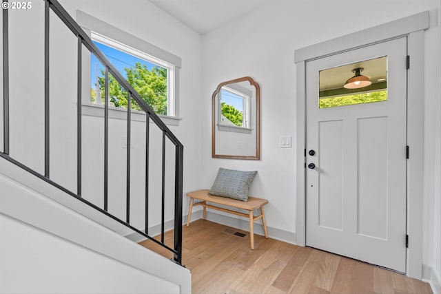 625 NE 69th Ave, Portland, OR 97213 - entrance foyer featuring light wood-style flooring, stairs, and baseboards