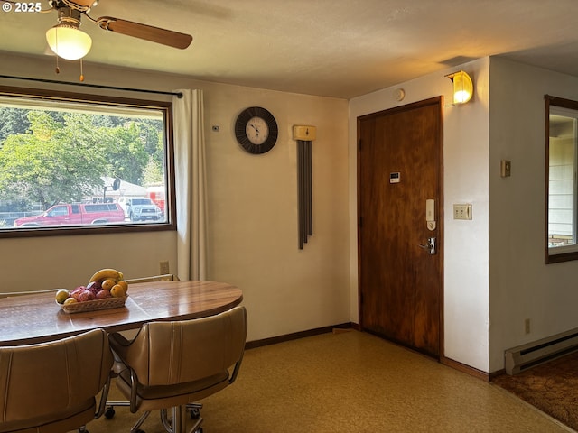 47858 W 1st St, Oakridge, OR 97463 - dining space featuring baseboard heating and a ceiling fan