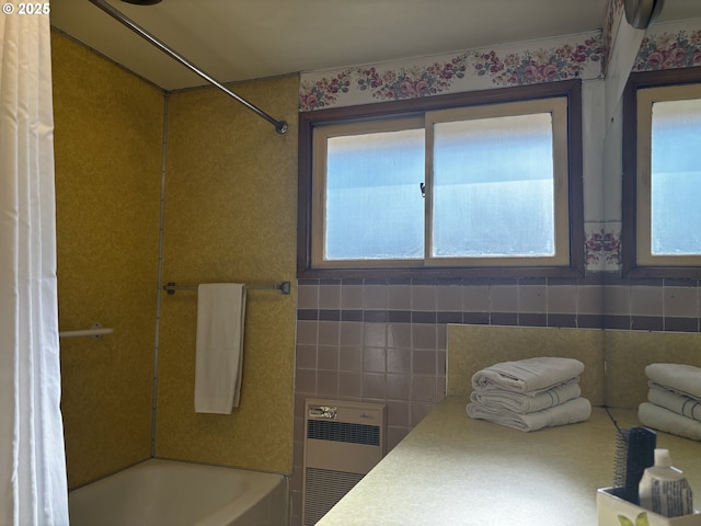47858 W 1st St, Oakridge, OR 97463 - full bathroom featuring shower / tub combo, heating unit, and tile walls