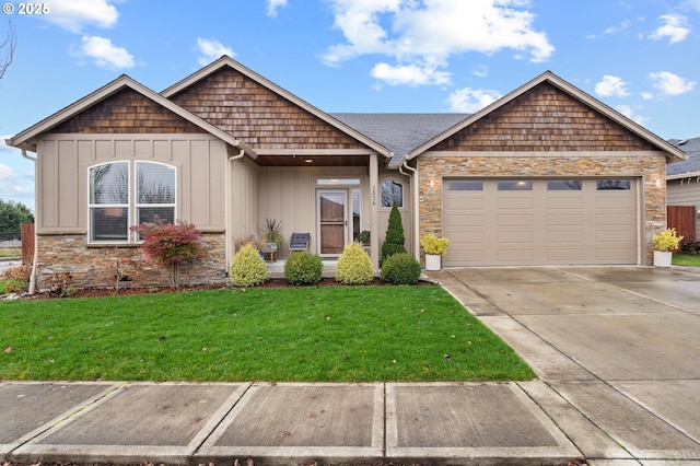 view of front of home with a garage and a front lawn