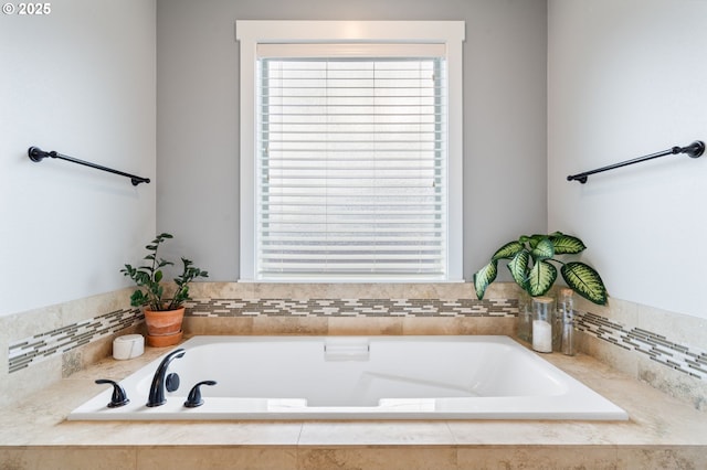 bathroom with tiled bath