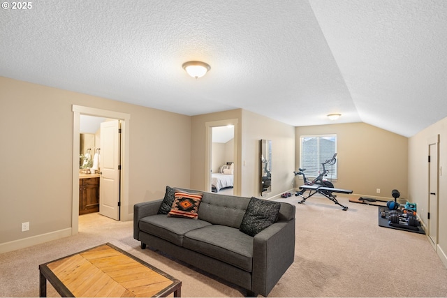 living room featuring a textured ceiling, light colored carpet, and vaulted ceiling