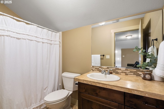 bathroom featuring backsplash, vanity, a textured ceiling, toilet, and lofted ceiling