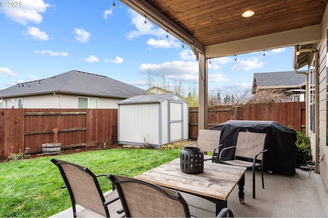 view of patio / terrace featuring a storage unit and a grill