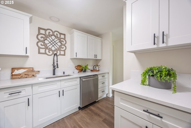 1109 SW 15th St, Lincoln City, OR 97367 - kitchen featuring stainless steel dishwasher, wood finished floors, light countertops, and white cabinetry