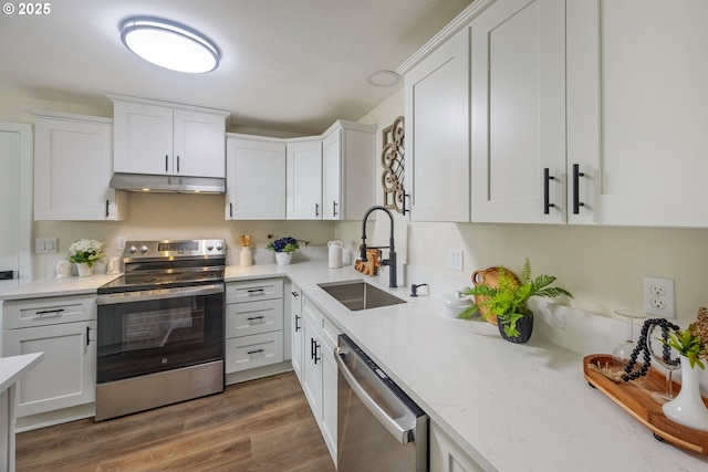 1109 SW 15th St, Lincoln City, OR 97367 - kitchen featuring appliances with stainless steel finishes, under cabinet range hood, and white cabinetry