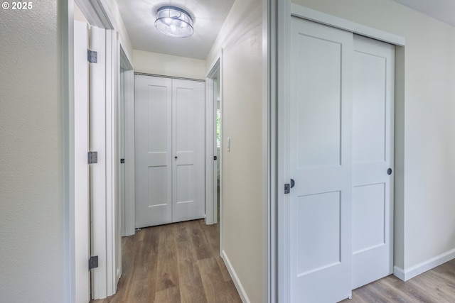1109 SW 15th St, Lincoln City, OR 97367 - hallway featuring wood finished floors and baseboards
