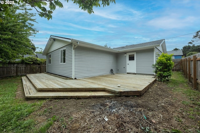 1109 SW 15th St, Lincoln City, OR 97367 - back of house featuring a fenced backyard and a wooden deck