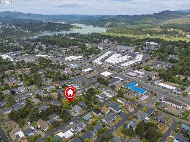 1109 SW 15th St, Lincoln City, OR 97367 - aerial view of property's location featuring a water and mountain view and a heavily wooded area