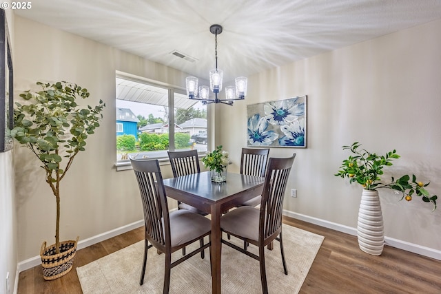 1109 SW 15th St, Lincoln City, OR 97367 - dining area with a chandelier and wood finished floors