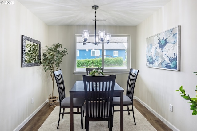 1109 SW 15th St, Lincoln City, OR 97367 - dining area with a chandelier and dark wood-style floors