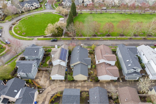 birds eye view of property with a residential view