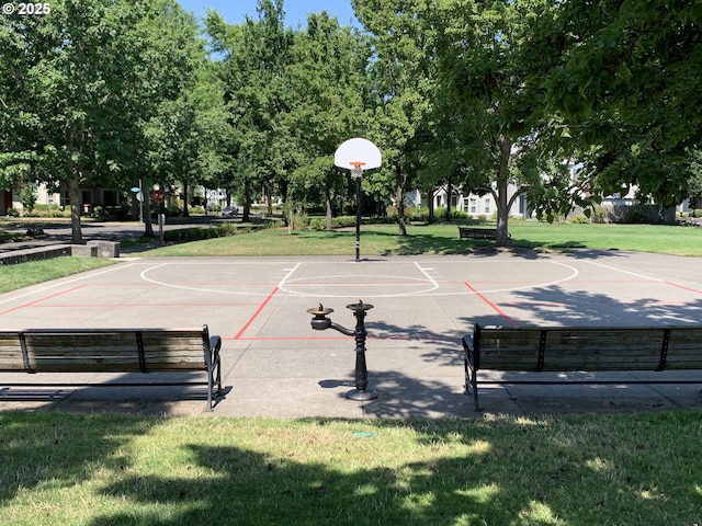 view of basketball court featuring a lawn and community basketball court