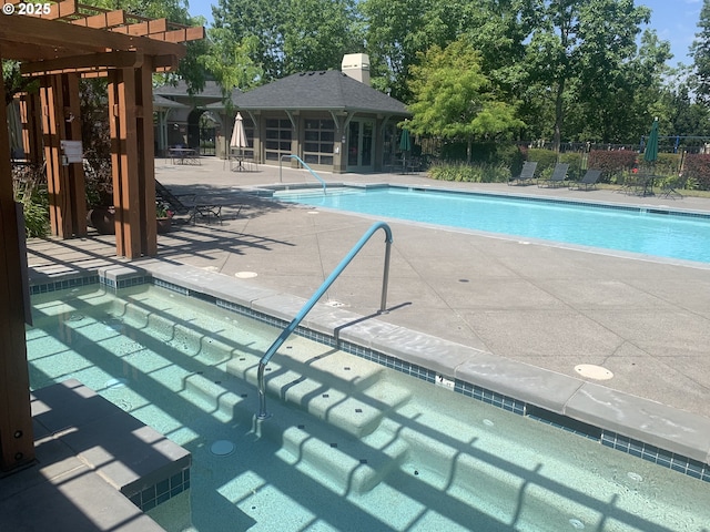 pool featuring french doors, a pergola, a patio, and fence