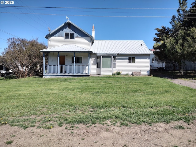300 S Mill St, Joseph, OR 97846 - back of house with a porch, a yard, metal roof, and a chimney