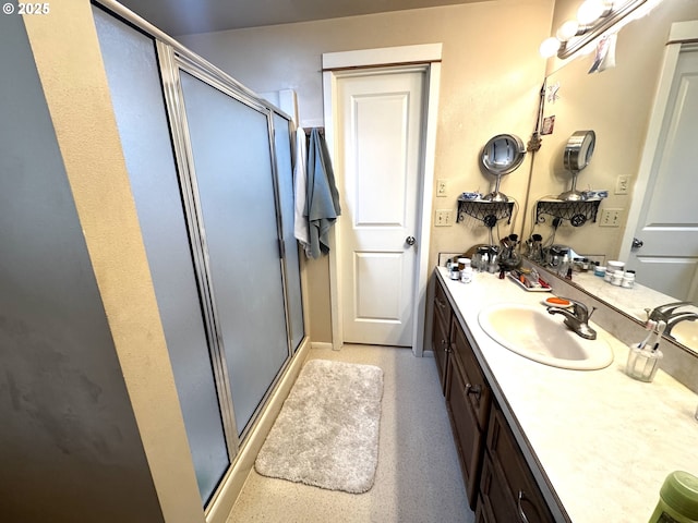 bathroom featuring vanity and a stall shower