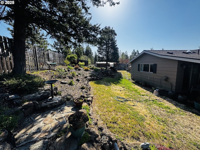 view of yard with a fenced backyard