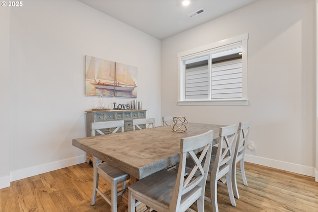 dining area with light hardwood / wood-style flooring