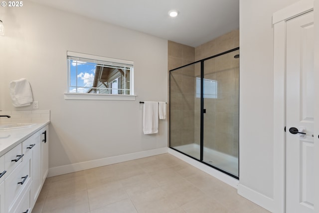 bathroom with tile patterned flooring, vanity, and an enclosed shower