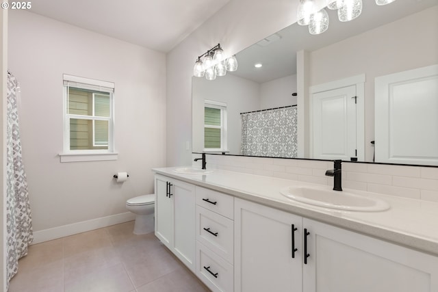 bathroom with decorative backsplash, tile patterned floors, vanity, and toilet