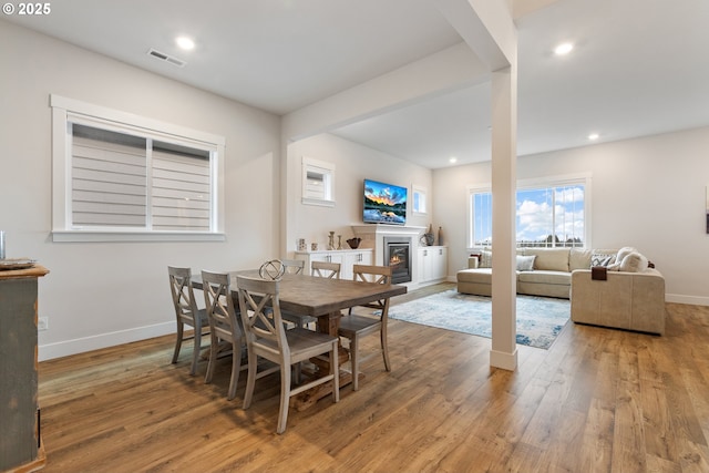 dining area with wood-type flooring