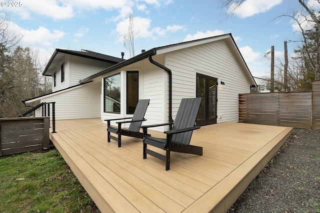 wooden deck featuring fence