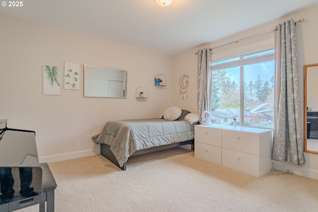 bedroom featuring carpet flooring and baseboards