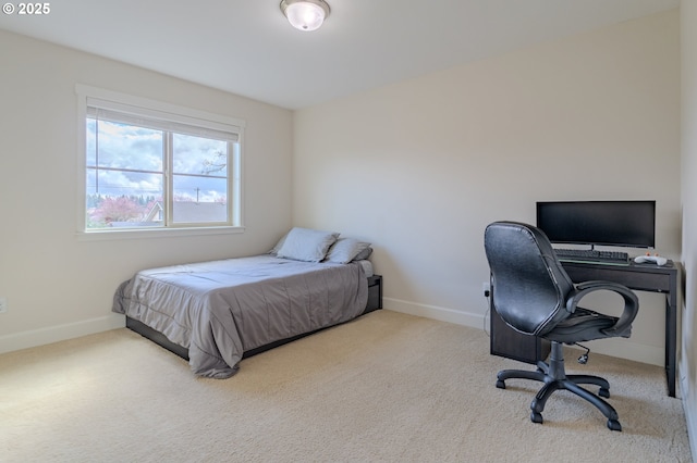 carpeted bedroom with baseboards