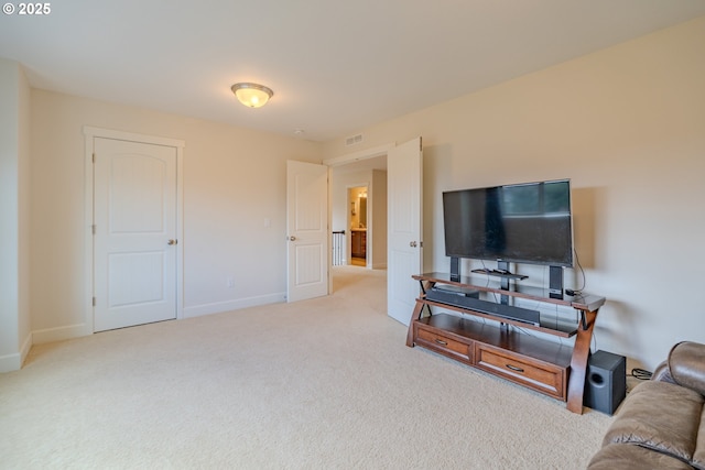 living room with carpet flooring, baseboards, and visible vents