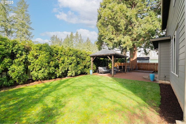 view of yard with a gazebo, fence, and a patio