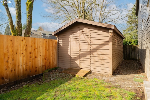 view of shed with a fenced backyard