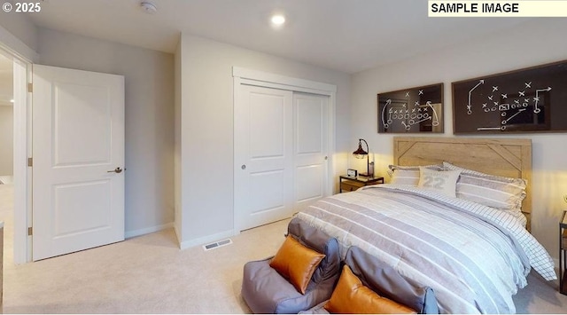 bedroom with light carpet and a closet