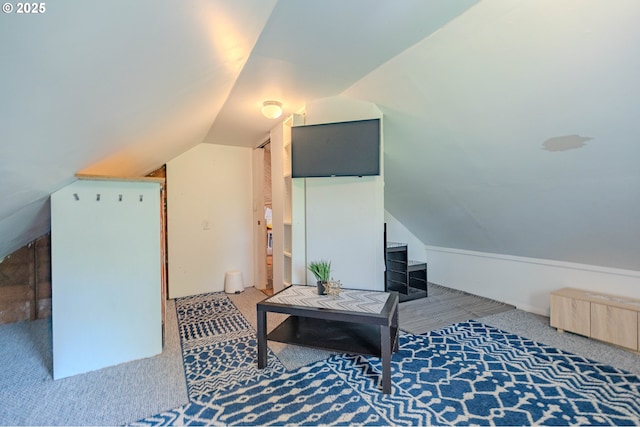 bonus room featuring carpet floors and lofted ceiling