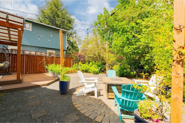 view of patio / terrace featuring fence and outdoor dining space