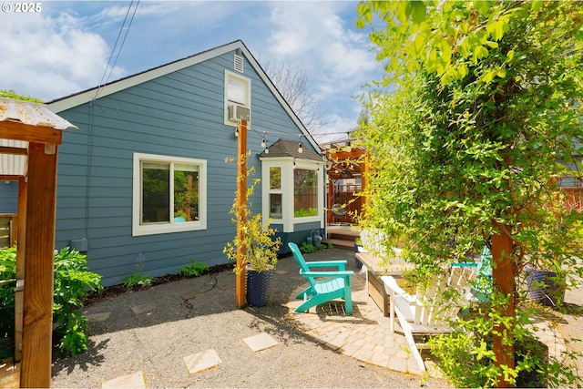 back of house with cooling unit and a patio area