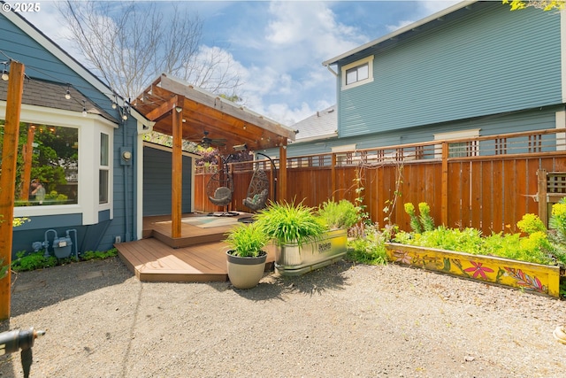 view of patio / terrace with fence, a ceiling fan, and a deck