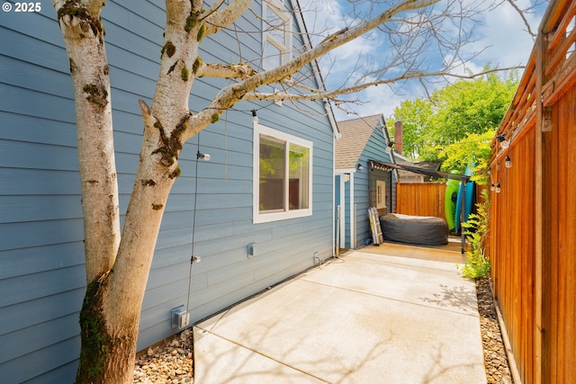 exterior space with a patio and fence