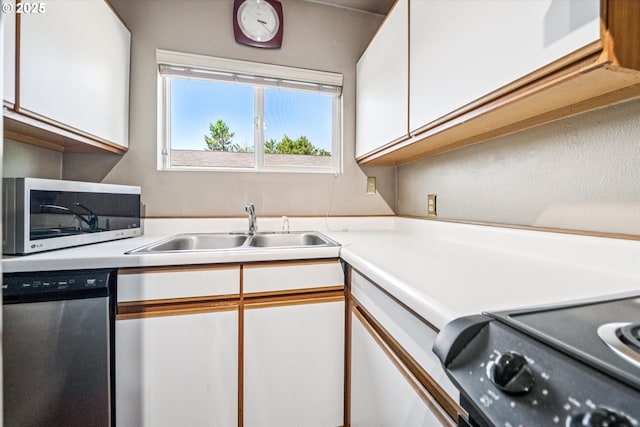 5246 SE 65th Ave, Portland, OR 97206 - kitchen with appliances with stainless steel finishes, white cabinets, and light countertops