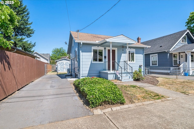 5246 SE 65th Ave, Portland, OR 97206 - bungalow-style house featuring driveway and a storage unit