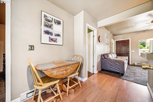 5246 SE 65th Ave, Portland, OR 97206 - dining space with a baseboard radiator, light wood finished floors, and ceiling fan