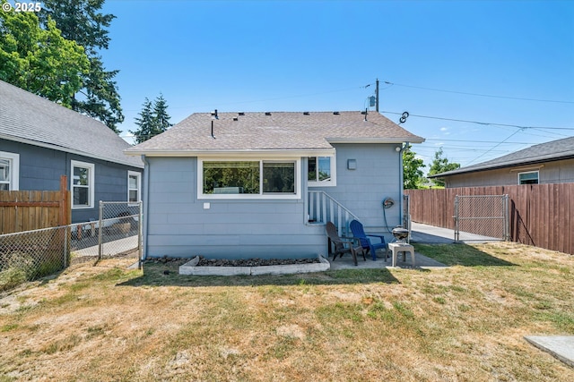 5246 SE 65th Ave, Portland, OR 97206 - rear view of house featuring a fenced backyard, roof with shingles, a gate, and a patio area
