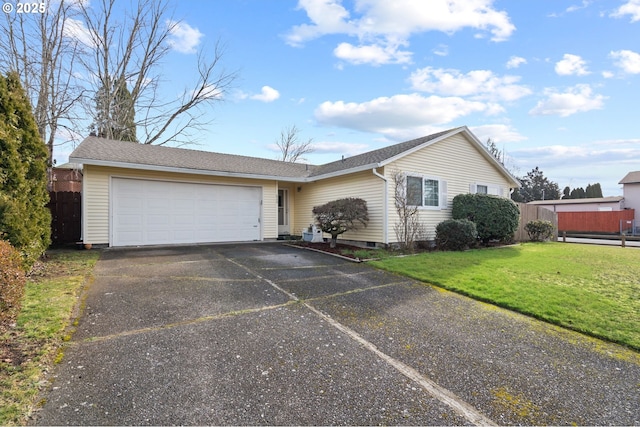 ranch-style home with a garage and a front lawn