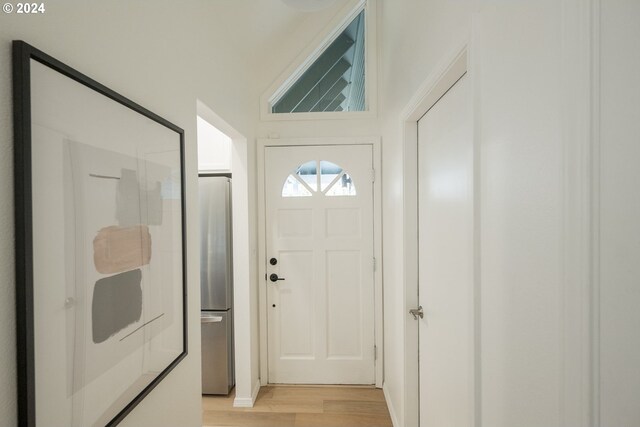 doorway to outside with light hardwood / wood-style flooring